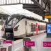 "Trem regional na plataforma da Gare de l'Est em Paris sob estrutura de ferro".